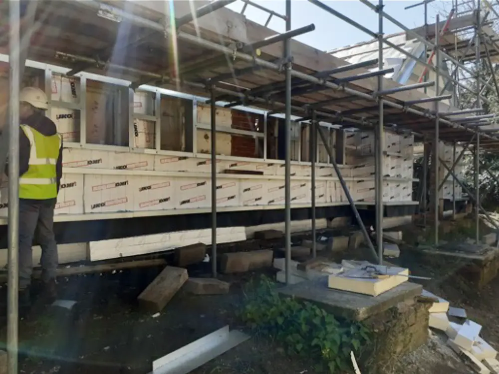 A photo of insulation being added to external walls.