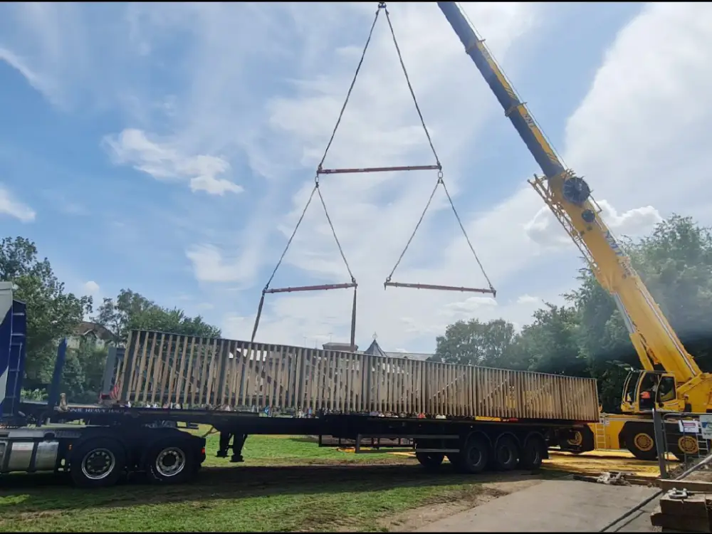 A photo of the new bridge being lifted into position.