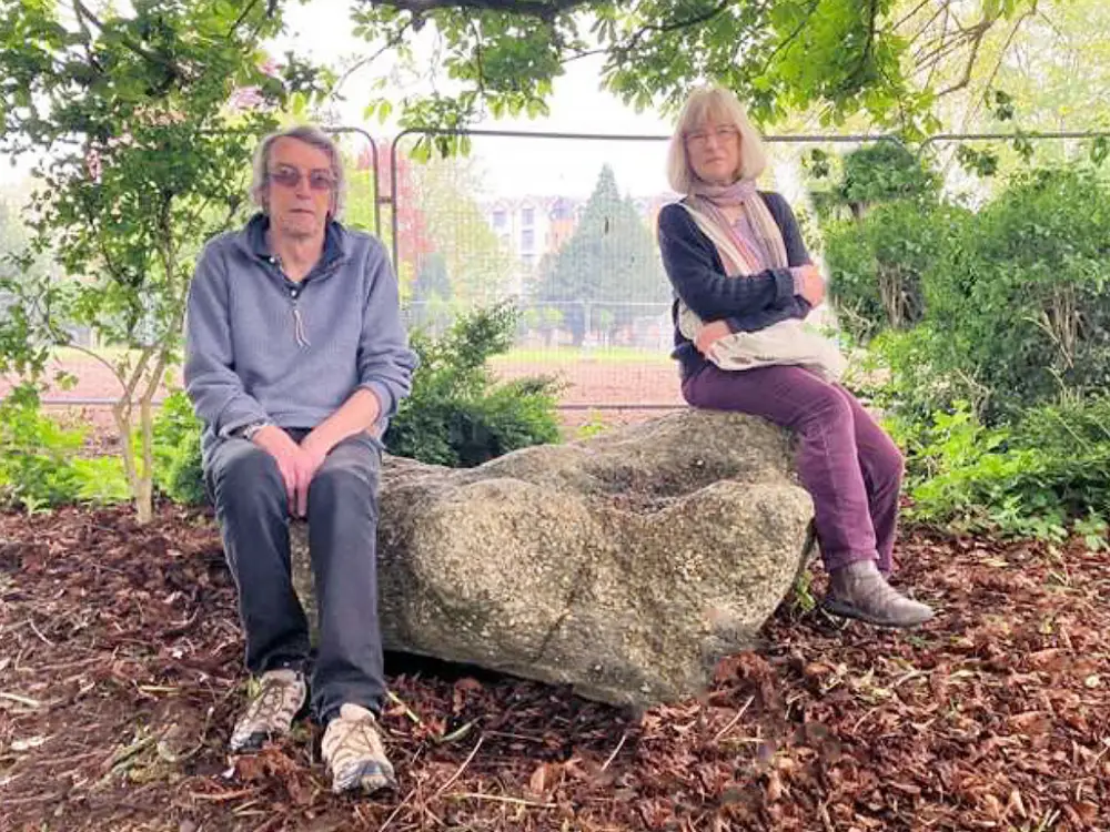 Roger Wilmot and Susan Harris of East Herts Geology Club with the puddingstone in Castle Park. Photo credit: Bishop’s Stortford Independent