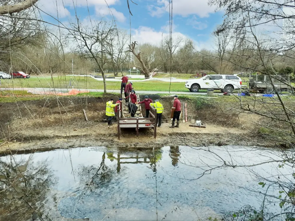 A photo of volunteers installing the viewing platform.
