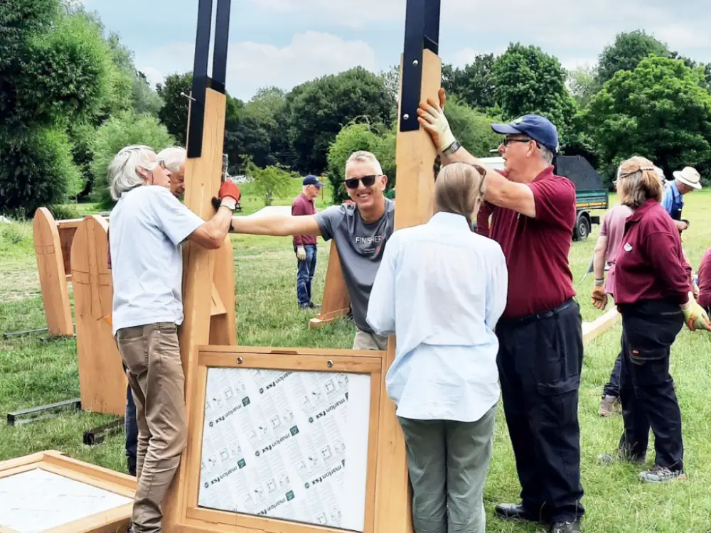 A photo of Friends of Castle Park and CMS volunteers installing signs.
